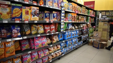 Cornflakes shelves and worker folding boxes, 11 mar 2020, Arequipa, Peru Stock Footage 126129902