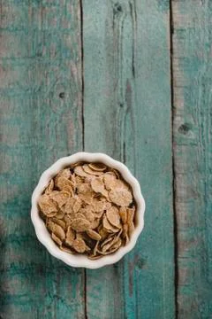 Cornflakes on wooden table Stock Photos