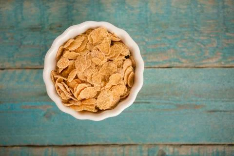 Cornflakes on wooden table Stock Photos