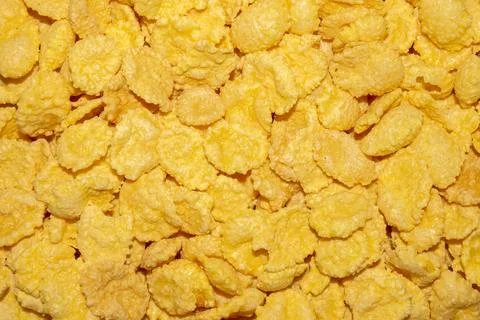Cornflakes.Ready-made breakfast of cornflakes.Cornflakes background. Stock Photos