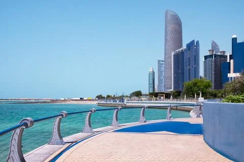 Corniche promenade in Abu Dhabi, UAE. Beautiful walkway in urban city park .. Stock Photos