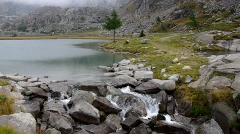 Cornisello lake and waterfall Stock Footage 60871091
