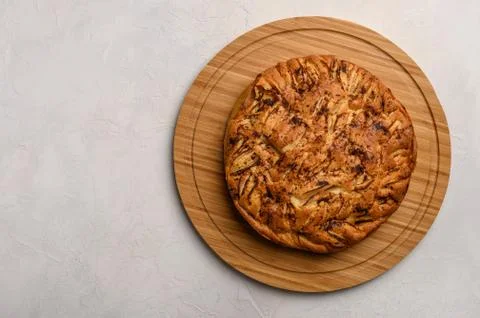 Cornish apple pie top view on rustic style white background. Copy space for your Stock Photos