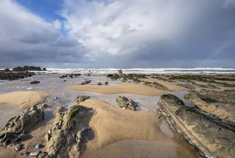 Cornish beach with a hint of a rainbow Foto stock
