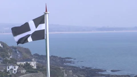 Cornish flag flying over mousehole Stock Footage 277528990