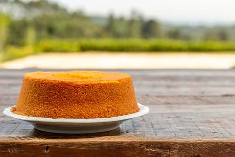 Cornmeal cake on rustic wooden table. A small piece of sky with space for tex Stock Photos