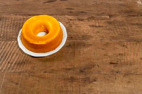 Cornmeal cake on rustic wooden table, top view and with space for text. Stock Photos