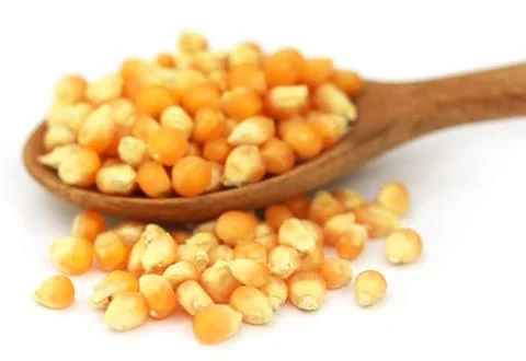 Corns with spoon Stock Photos