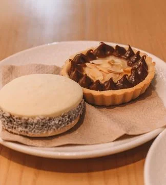 Cornstarch, coconut and dulce de leche alfajor, typical South American Stock Photos