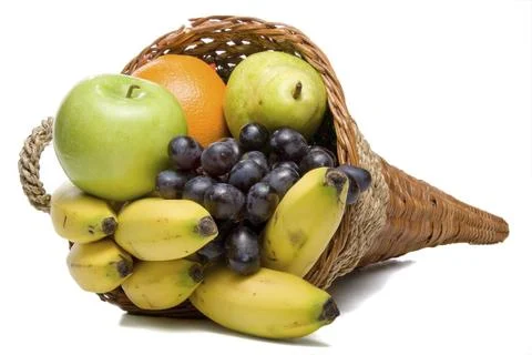 A cornucopia basket filled with delicious fresh fruit Stock Photos
