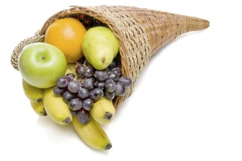 A cornucopia basket filled with delicious fresh fruit Stock Photos