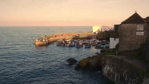 Cornwall England 14th September 2019 Coverack harbour in the evening ligtevening Stock Footage 130892906