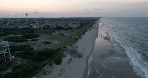 Corolla, NC beach coastline in the outer banks. Aerial drone shot at sunset. Stock Footage 135412303