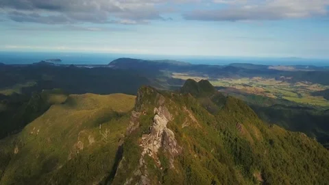 Coromandel Mountain ranges through to the ocean. The aerial shot pulls Stock Footage 204834842