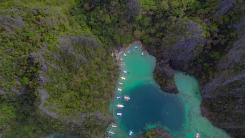 Coron Palawan lagoon with docked outrigger boats. Nice aerial view drone Stock Footage 344626998