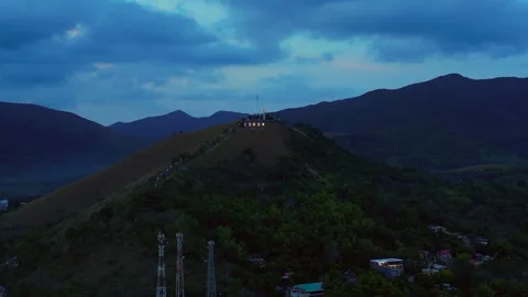 Coron town sign illuminating Mount Tapyas at dusk. Nice aerial view drone Stock Footage 344623068
