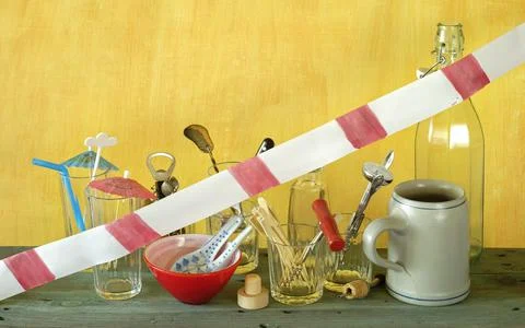 Corona lockdown of bars and pubs, utensils with warning tape closed bar Stock Photos