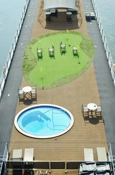 Corona lockdown for cruises, sun deck of a cruise liner with empty chairs Stock Photos