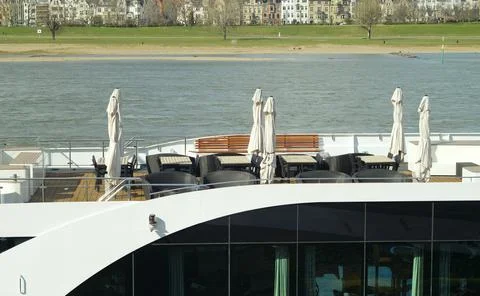 Corona lockdown for river cruises, deck of cruiseship with empty chairs and in Stock Photos