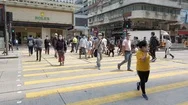 Corona Pandemic, People Crossing The Street In Downtown Hong Kong Wearing Stock Footage