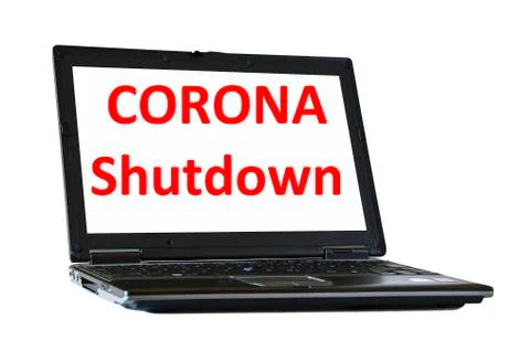 Corona shutdown written on notebook screen Stock Photos