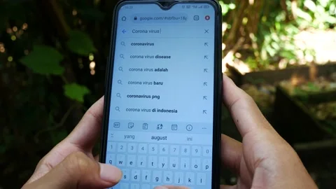 Corona virus 2022 update Google search results on a modern smartphone Stock Footage 204784071