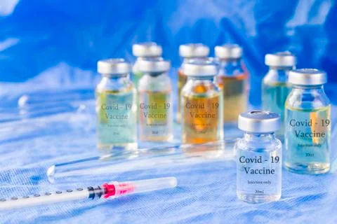 Corona virus and Covid - 19 new vaccine in ampules, different color variation Stock Photos