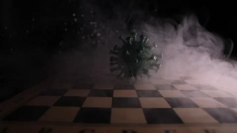 Corona virus miniature model on chessboard 스톡 동영상 130514538