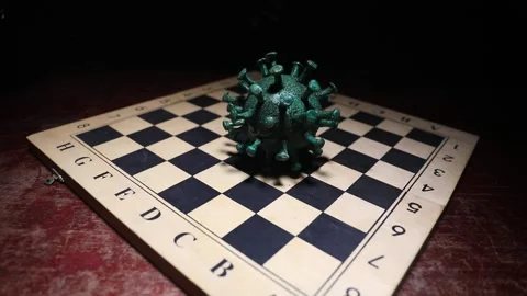Corona virus miniature model on chessboard 스톡 동영상 130515183