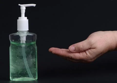Corona Virus Protection. Hands using hand sanitizer gel pump dispenser. Healt Stock Photos