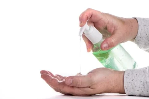 Corona Virus Protection. Hands using hand sanitizer gel pump dispenser. Healt Stock Photos