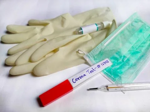 Corona Virus testing kit in hands on lab table Stock Photos