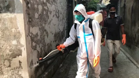 Corona warrior spraying liquid Stock Footage 142817007