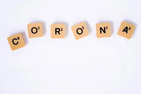 Corona word on rustic plastic tiles alphabet puzzle board game Stock Photos