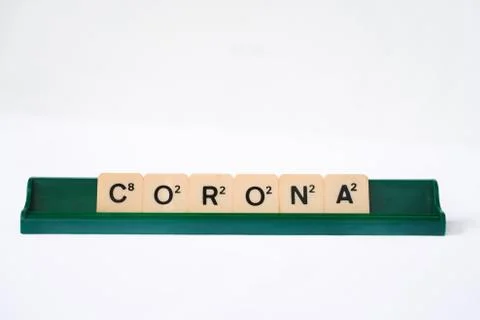 Corona word on rustic plastic tiles alphabet puzzle board game Stock Photos