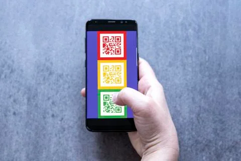 CORONAVIRUS app with QR code system application on the smartphone. Stock Photos