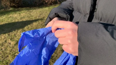 Coronavirus. Close-up female hands put on protective gloves. Stock Footage 128220950