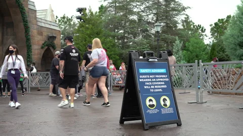 Coronavirus / Covid-19 at Universal Studios Orlando Amusement Park Mask Sign Stock-Footage 144582462