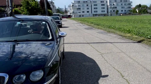 Coronavirus. the driver gets out of the car and puts on a mask Stock Footage 132174675