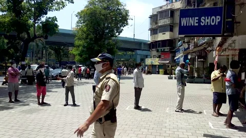 Coronavirus India lockdown queue for liquor Stock Footage 142471246