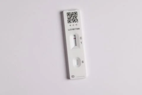 Coronavirus lateral flow self test kit on white background showing negative r Stock Photos