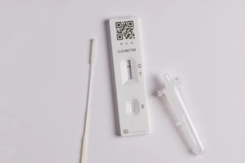Coronavirus lateral flow self test kit on white background showing negative r Stock Photos