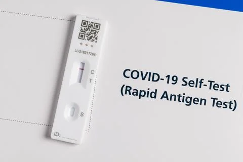 Coronavirus lateral flow self test kit on white background showing negative r Stock Photos