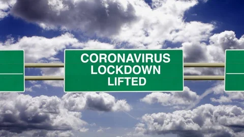Coronavirus Lockdown Lifted sign with a background of timelapse clouds. Video stock 128636842