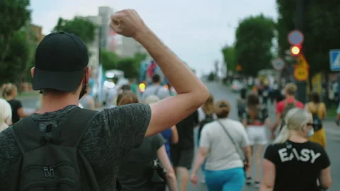 Coronavirus lockdown opposition strike, Rebel resistance man waves arm fist. Stock Footage 160979992