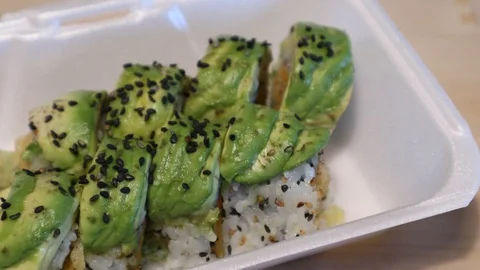 Coronavirus Lockdown Sushi Takeout Using Skip the Dishes, DoorDash, UberEats 動画素材 128570540
