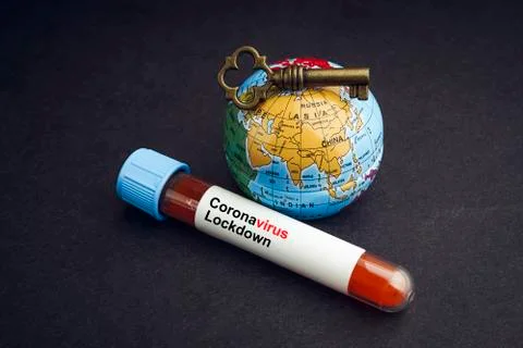 CORONAVIRUS LOCKDOWN text with world globe, key and Blood test vacuum tube on Photos