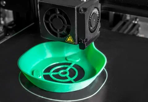 A coronavirus mask is printed on a 3D printer. Stock Photos