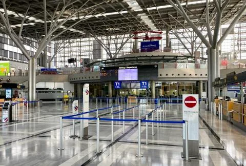 Coronavirus outbreak: Empty check-in desks at the airport terminal due to Stock Photos