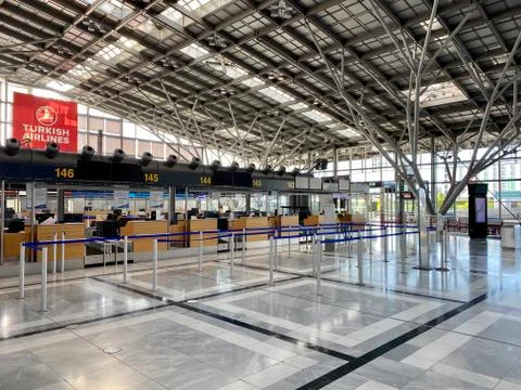 Coronavirus outbreak: Empty check-in desks at the airport terminal due to Stock Photos